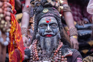 Masan Holi, Portrait of an male artist act as lord shiv with dry ash on face and body during...