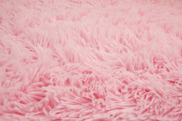 Close up of pink fur carpet background.	