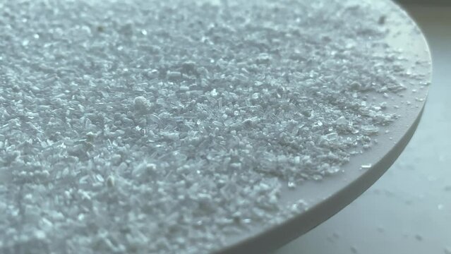 floating. Magnesium sulfate.close up of salt. Epsom salt.salt. Slow motion video. High quality video in 4K format.