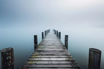 Gordijnen A wooden pier extending out over a calm lake. © STOCKAI
