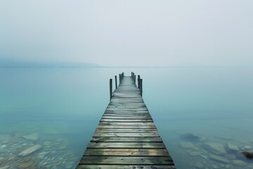 A wooden pier extending out over a calm lake.