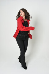 full length portrait of beautiful brunette woman model, wearing red trench coat jacket leather...