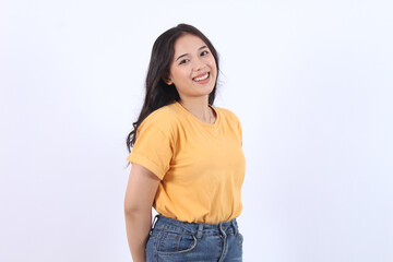 Cheerful Asian woman with confident smile looking at camera wearing yellow t-shirt isolated white background