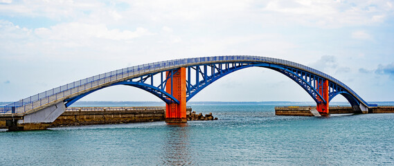 View  of the Xiying Rainbow Bridge in Magong, Penghu Islands, Taiwan. - obrazy, fototapety, plakaty