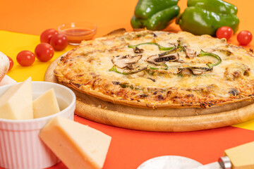 special pizza with ingredients on colorful background