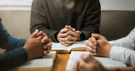 Ideas for praying to God in the home as a team Young men sitting and praying together Ready to pray...