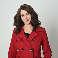 head and shoulders close up portrait of beautiful brunette woman model, wearing red trench coat...
