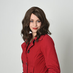 head and shoulders close up portrait of beautiful brunette woman model, wearing red trench coat...