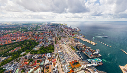 Helsingborg, Sweden. Panorama of the city in summer with port infrastructure. Oresund Strait....
