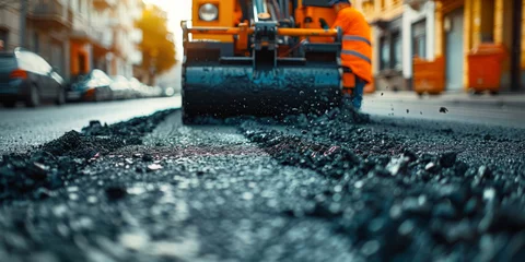 Gordijnen asphalt pavement workers working on asphalt road,Construction site is laying new asphalt road pavement,road construction workers and road construction machinery scene   © Planetz
