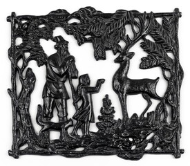Purchased (consumer) slotted bas-relief of the fairy tale "Silver Hoof" made of cast iron close-up on a white background