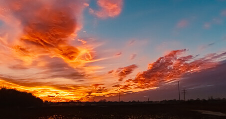 Sunset with dramatic clouds near Plattling, Isar, Deggendorf, Bavaria, Germany