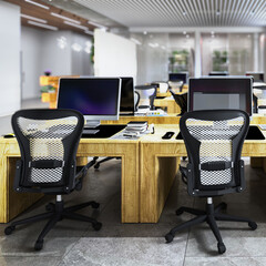 Computer workstations in an open, modern office (focus in the foreground) - 3D visualization - 772058241