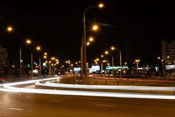 Fototapeta na wymiar Night city with traces of car headlights.