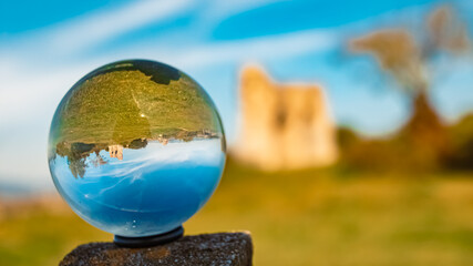 Crystal ball autumn or indian summer landscape shot with ancient castle ruins at Winzer, Danube, Deggendorf, Bavaria, Germany - obrazy, fototapety, plakaty