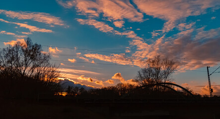 Sunset with a bridge silhouette near Plattling, Isar, Bavaria, Germany