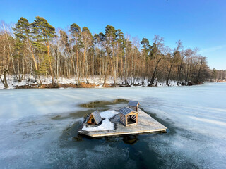 The Moscow region, the city of Balashikha. Pekhorka River in spring in the area of the park "Pekhorka forest", houses for ducks