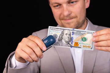 Businessman with american money in hand. The concept of giving a bribe to an official.