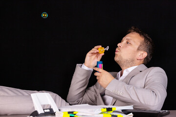 Concept businessman has nothing to do at work. All work is done.