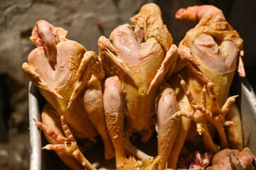 homemade plucked chicken meat. chicken carcasses close-up
