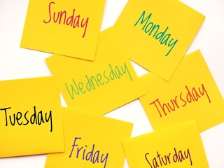 Seven days of the week background with yellow sticky notes.