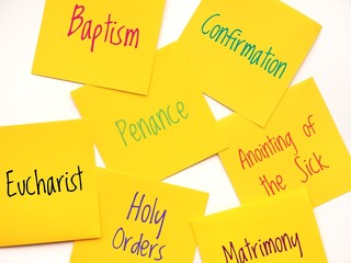 Yellow Sticky notes with the seven sacraments. Paper notes background with the 7 sacraments written on them
