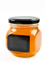 Jar of honey with nuts on white background