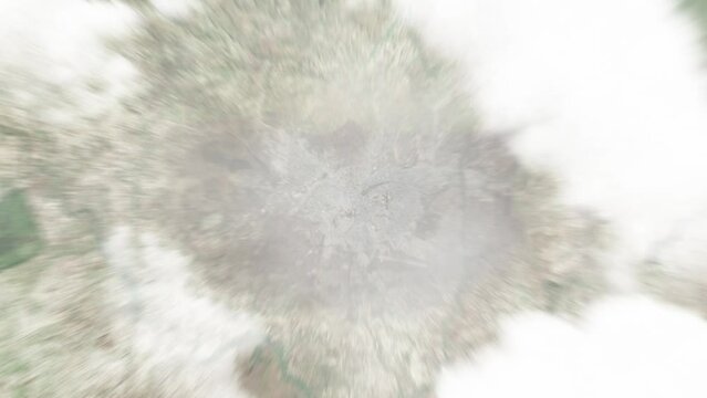 Earth zoom in from space to Huambo, Angola. Followed by zoom out through clouds and atmosphere into space. Satellite view. Travel intro. Images from NASA