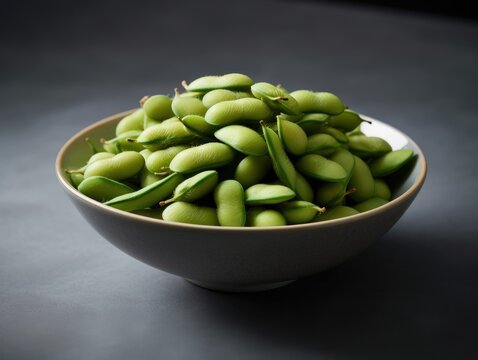 Bowl of fresh edamame, immature soybeans, in their pods.