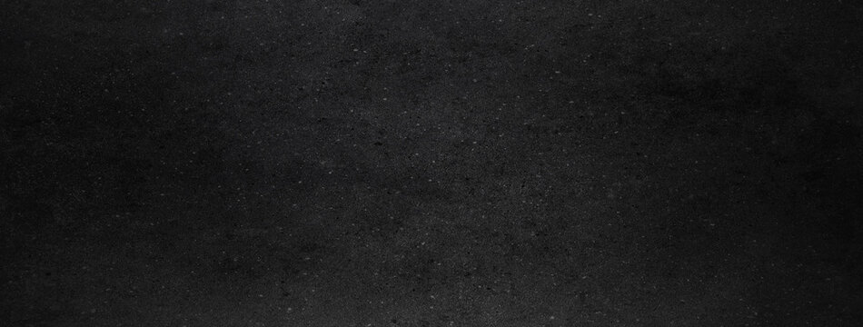 Dark black concrete wall background or texture
