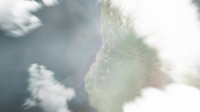 Earth zoom in from space to Moroni, Comoros. Followed by zoom out through clouds and atmosphere into space. Satellite view. Travel intro. Images from NASA
