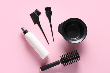 Set of professional hairdresser's tools on pink background