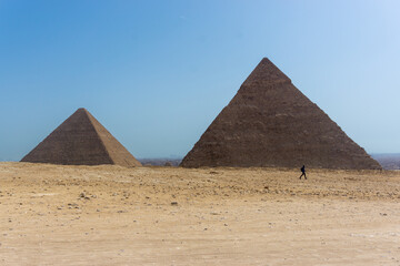 Fototapeta na wymiar Desert view with Pyramid of Khafre, and the Pyramid of Menkaure, Giza pyramid complex, Cairo, Egypt