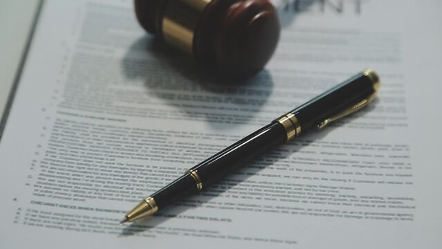 Business and lawyers discussing contract papers with brass scale on desk in office. Law, legal services, advice, justice and law concept picture with film grain effect