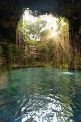 Ik-Kil Cenote - Lovely cenote in Yucatan Peninsulla with transparent waters and hanging roots. Chichen Itza, Mexico