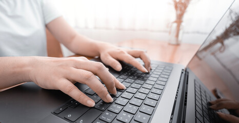 female hands typing on a computer, server and surfing the internet in a general office. hands adult working in an organization,  internet network communication and working concept.