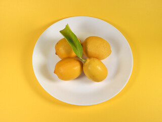 lemons in a dish - 772142657