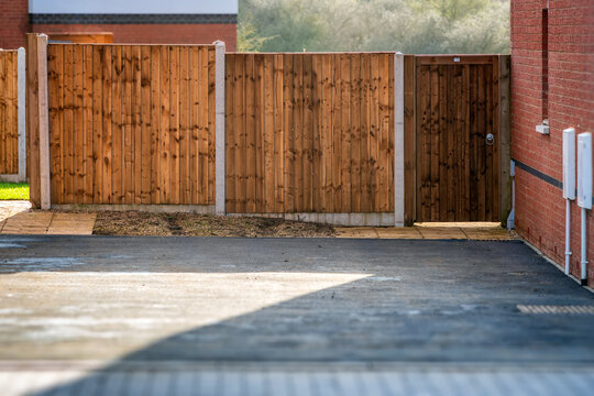 new built wooden boarded fence background in english town uk