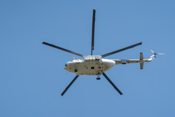Bottom view of a helicopter in flight. propellers fixed.