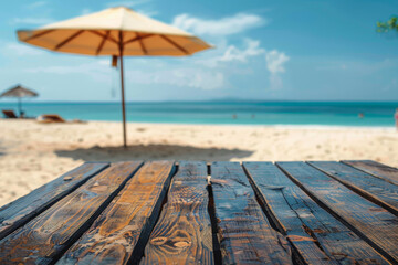 Fototapeta premium Tropical Beach Escape: Sunlit Umbrella and Wooden Table Overlooking Ocean