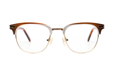 A pair of stylish glasses rests on a crisp white background