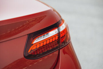 Modern car rear taillight lamp close-up view. The clean trunk of modern car