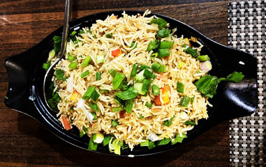 Vegetable Fried Rice is a culinary symphony of fluffy rice grains mingled with an assortment of colorful diced vegetables, sautéed to perfection. A harmonious balance of textures and flavors.
