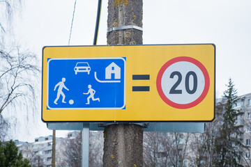 Sign meaning Living street or recreation area. Road sign indicates the place where the traffic regime specified for the yard area will apply.  - obrazy, fototapety, plakaty