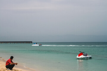 Fototapeta na wymiar Jet ski on the beach on a summer day illustrating water sports and activities in Kish Island, Iran.