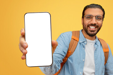 Man showing smartphone to camera