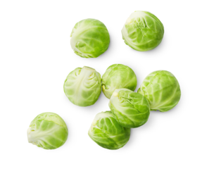 scattered Brussels sprouts on isolated white background, top view