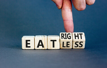 Eat less or right symbol. Concept words Eat less or Eat right on wooden cubes. Beautiful grey table...