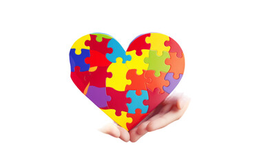 A hand delicately holds a heart-shaped puzzle piece