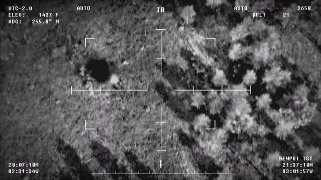 Military drone searching for the rival tank in the action mission zone. Drone flying above the mission area looking for enemy tank. Drone launches a missile at the detected tank. Warfare mission
